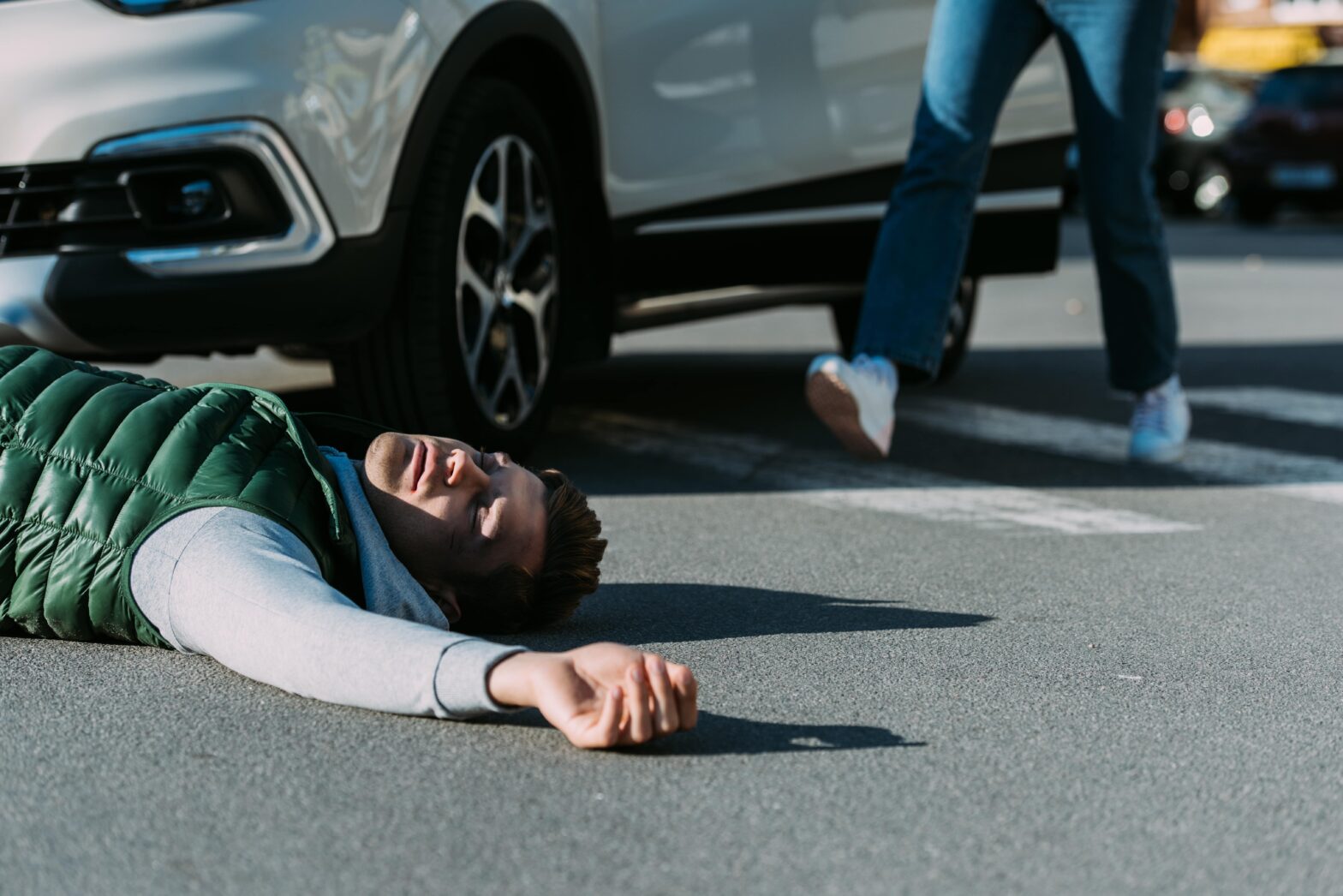 man hit by a car in a crosswalk